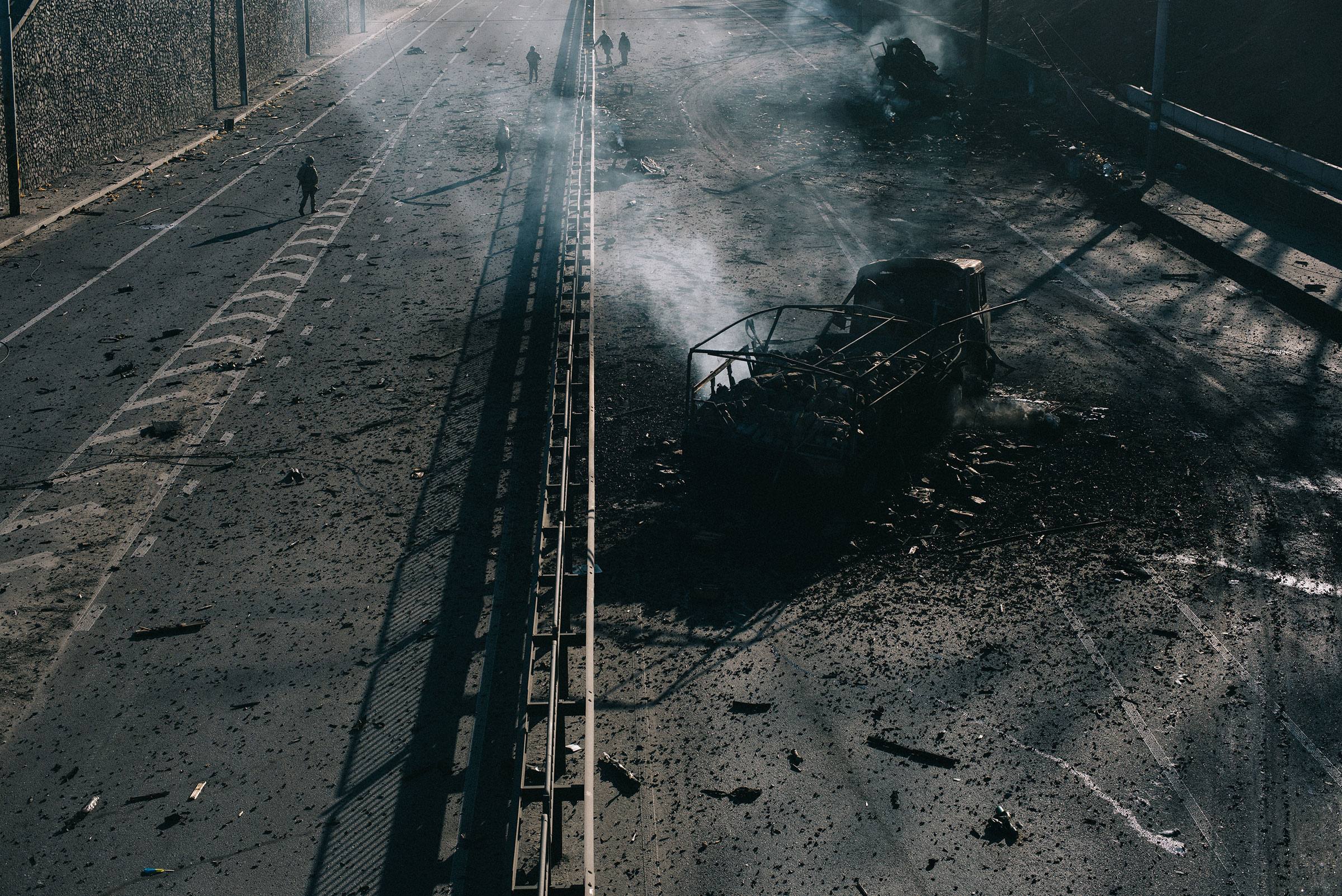 The burned-out husk of a Russian military vehicle sits on a highway leading into Kyiv. It was destroyed by Ukrainian forces as they defended the capital on the third night of the Russian invasion (Maxim Dondyuk)