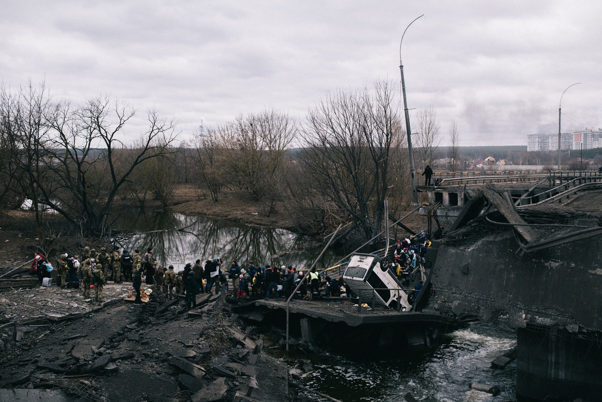 Evacuation of civilians from Irpin town, through a bridge destroyed by shelling. The bridge was destroyed by the Armed Forces of Ukraine to prevent the enemy from reaching Kyiv. On this day at 10 am women, children and the elderly were supposed to be evacuated from the town by trains, but the enemy blew up the railroad tracks, and so people were asked to move to another place, from where they should be picked up by buses for transportation to the Kyiv railway station. Irpin town, Kyiv region, Ukraine, 05.03.2022