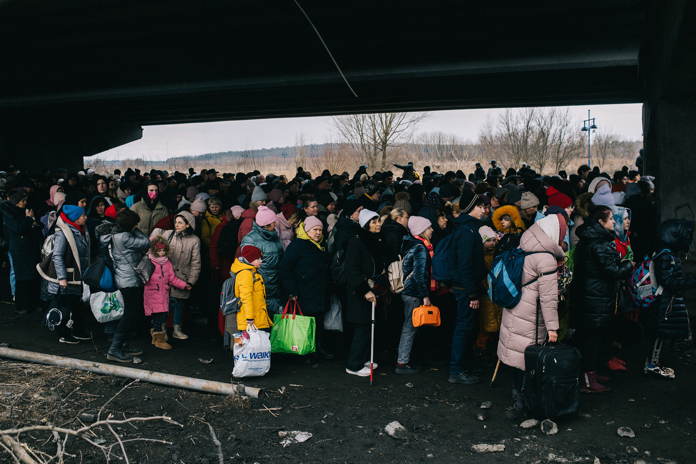 Evacuation of civilians from Irpin town, through a bridge destroyed by shelling. The bridge was destroyed by the Armed Forces of Ukraine to prevent the enemy from reaching Kyiv. On this day at 10 am women, children and the elderly were supposed to be evacuated from the town by trains, but the enemy blew up the railroad tracks, and so people were asked to move to another place, from where they should be picked up by buses for transportation to the Kyiv railway station. Irpin town, Kyiv region, Ukraine, 05.03.2022