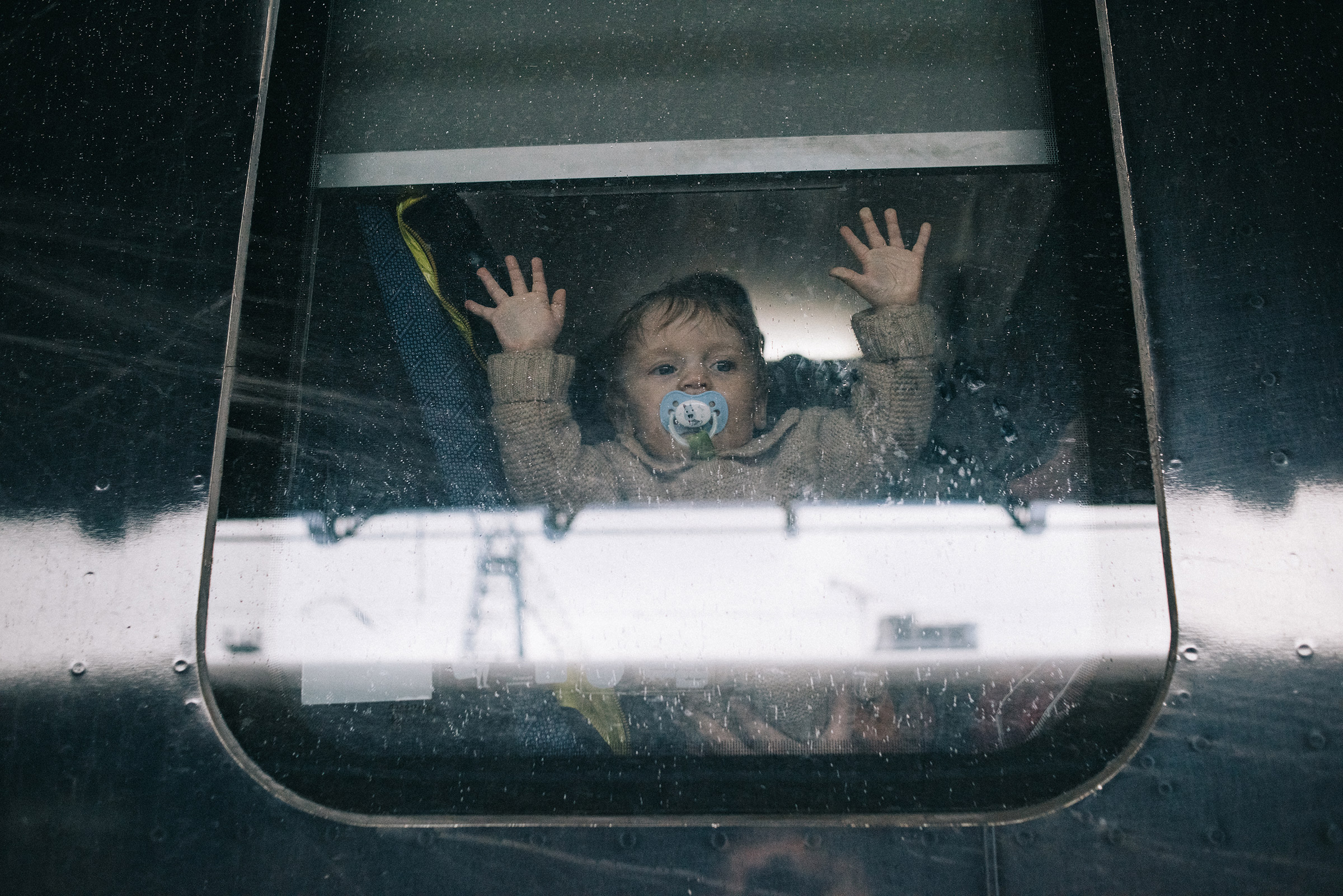 A child boards a train in Kyiv on March 2, where long lines of people are evacuating the city