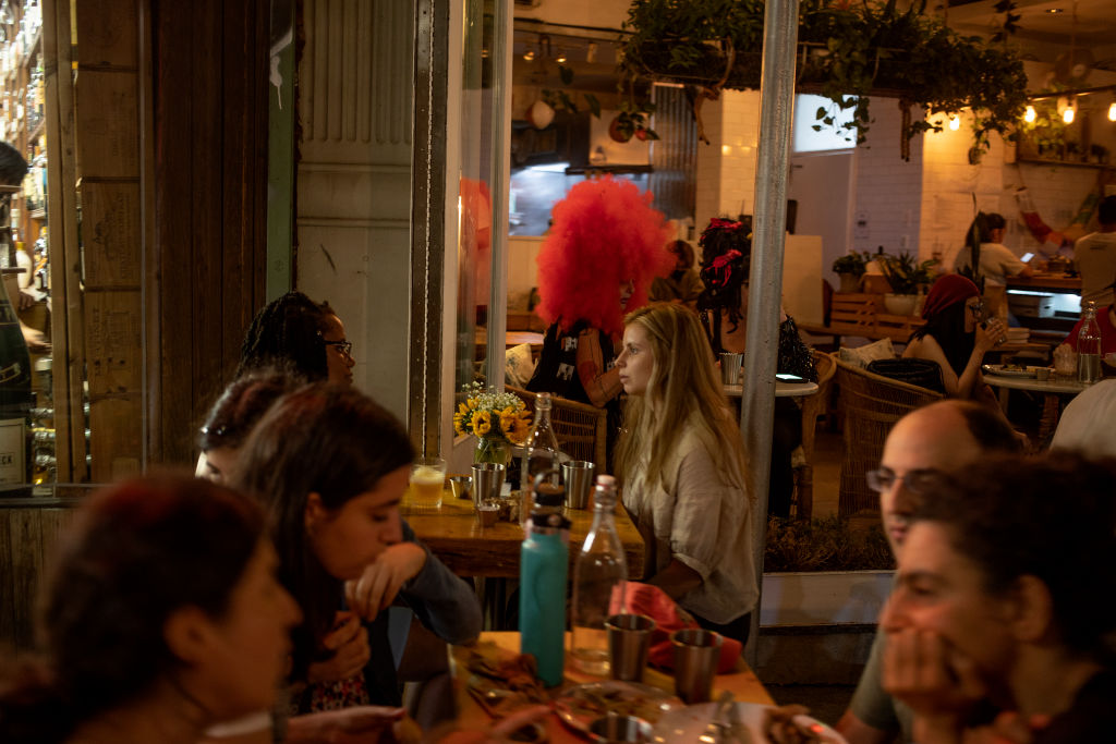 Restaurants and bars overflowing as nightlife returns to New York City on June 25, 2021. (Andrew Lichtenstein/Corbis—Getty Images)