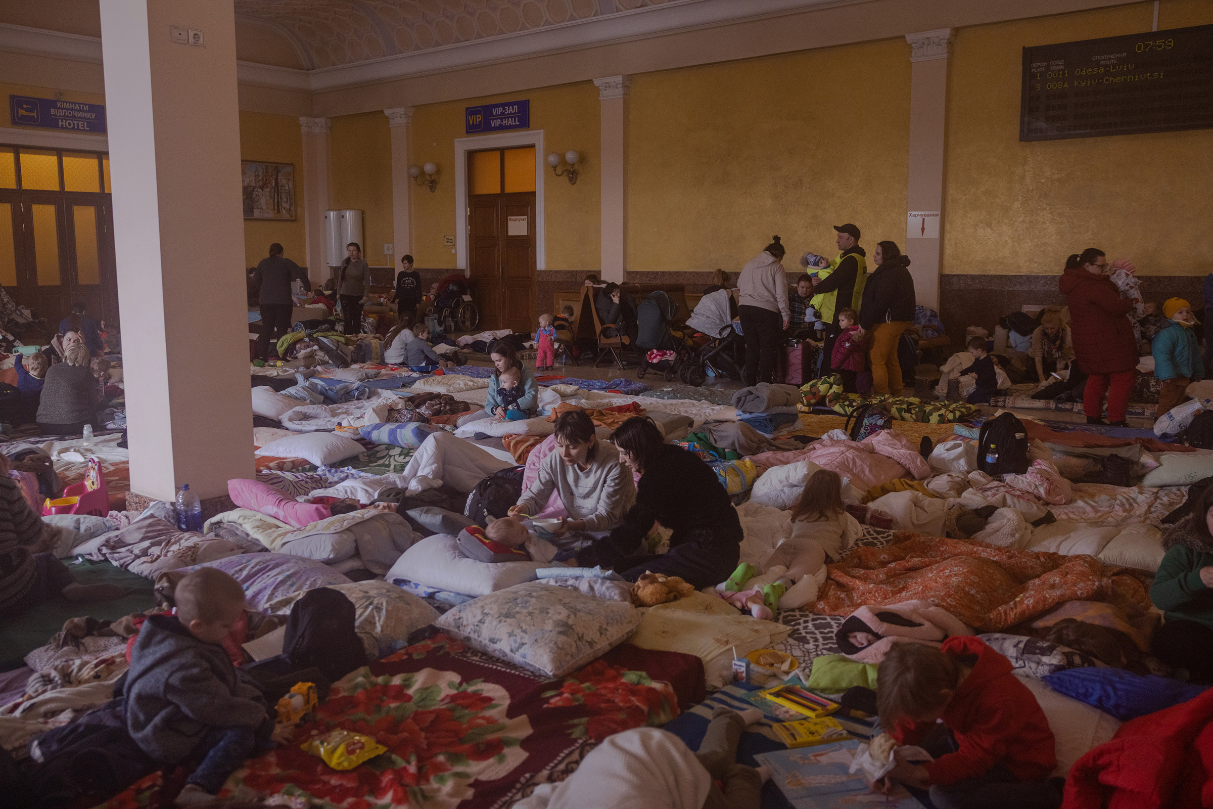 In a room upstairs in the Lviv train station, designated as a shelter for women and children, many take a moment to rest, on March 8.