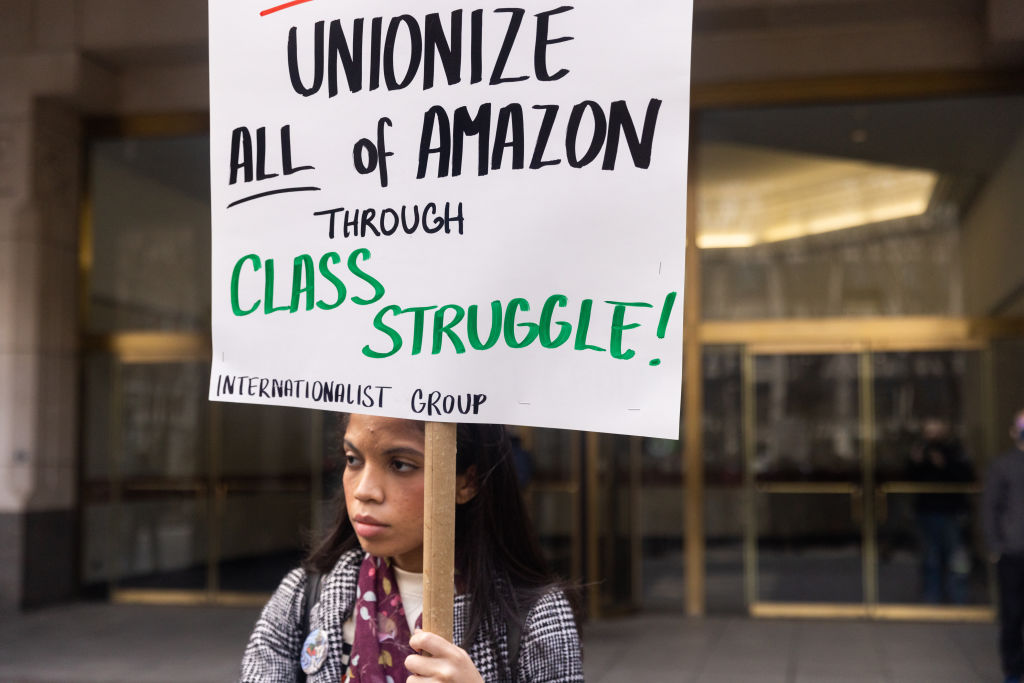 A supporter holds a sign before the vote count to unionize Amazon workers is announced outside the National Labor Relations Board offices in the Brooklyn borough of New York on April 1, 2022. (Jeenah Moon/Bloomberg/Getty Images)