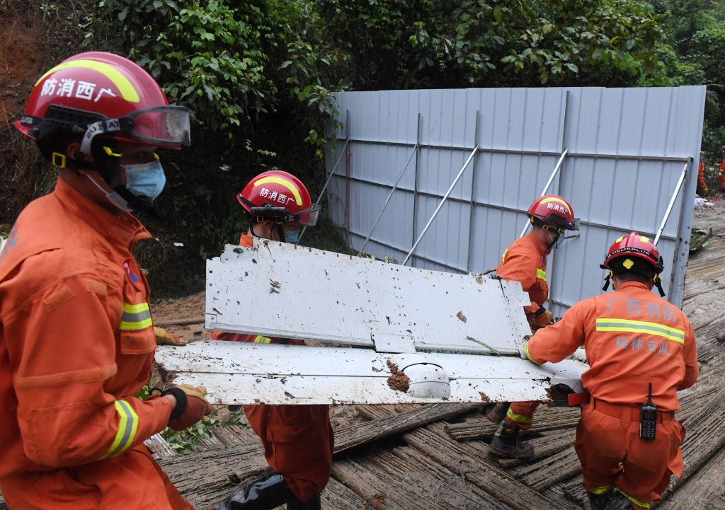 Rescuers conduct search and rescue work at a plane crash site in Tengxian County, south China's Guangxi Zhuang Autonomous Region, March 24, 2022. (Photo by Lu Boan—Xinhua/Getty Images)