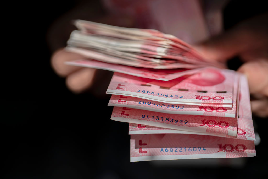 A person counts Chinese  banknotes in Tianjin, China, on Oct. 24, 2020 (Zhang Peng—LightRocket/Getty Images)
