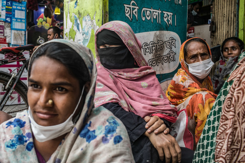 Homeless people waiting for food donations in Dhaka, Bangladesh, on July 12, 2021. (Sazzad Hossain/SOPA Images/LightRocket via Getty Images)