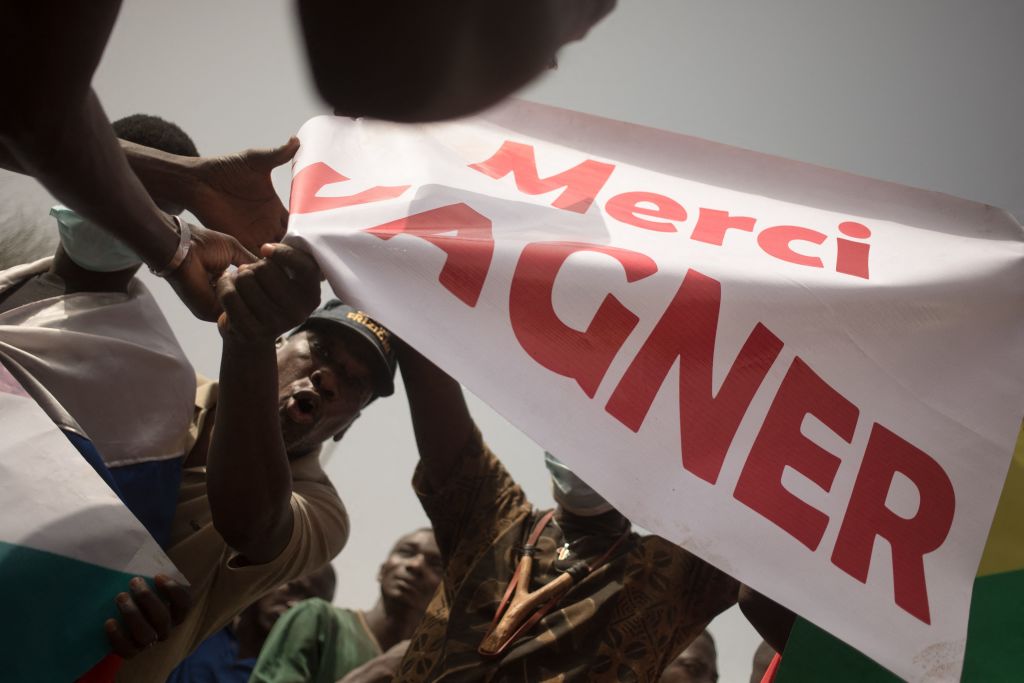 Protesters hold a banner reading "Thank you Wagner," the name of the Russian private security firm in Mali, during a celebration of the French military withdrawal, Bamako, Feb. 19, 2022. (FLORENT VERGNES/AFP via Getty Images)
