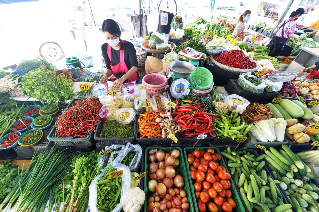 Vendors are seen at a food market in Bangkok, Thailand, March 30, 2022. Thailand's central bank said Wednesday that the Southeast Asian country's headline inflation will exceed this year's target range on higher energy and food prices (Rachen Sageamsak/Xinhua via Getty Images)