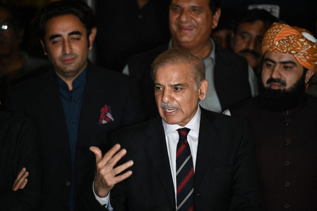 Pakistan's opposition leader Shahbaz Sharif (C) speaks flanked by Bilawal Bhutto Zardari (L) during a press conference with other parties leaders in Islamabad on April 7, 2022 after a Supreme Court verdict. (AAMIR QURESHI/AFP—Getty Images))