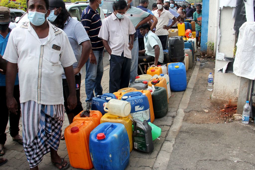 People wait in a queue to buy diesel at a Ceylon Petroleum Corporation fuel station in Colombo on Apr. 9, 2022. (AFP via Getty Images)