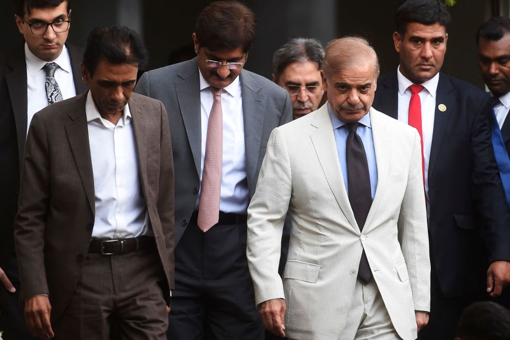 Pakistan's Prime Minister Shehbaz Sharif and leader of the Muttahida Qaumi Movement and collation partners of the newly formed government Khalid Maqbool Siddiqui leave after a meeting in Karachi on April 13, 2022. (Asif Hassan—AFP/Getty Images)