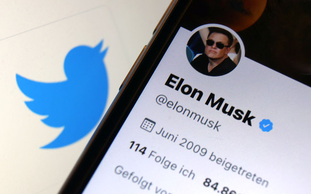 Elon Musk's Twitter account is seen in front of the logo of the Twitter news platform. Twitter is heading for takeover by tech billionaire Elon Musk. (Karl-Josef Hildenbrand-picture alliance)