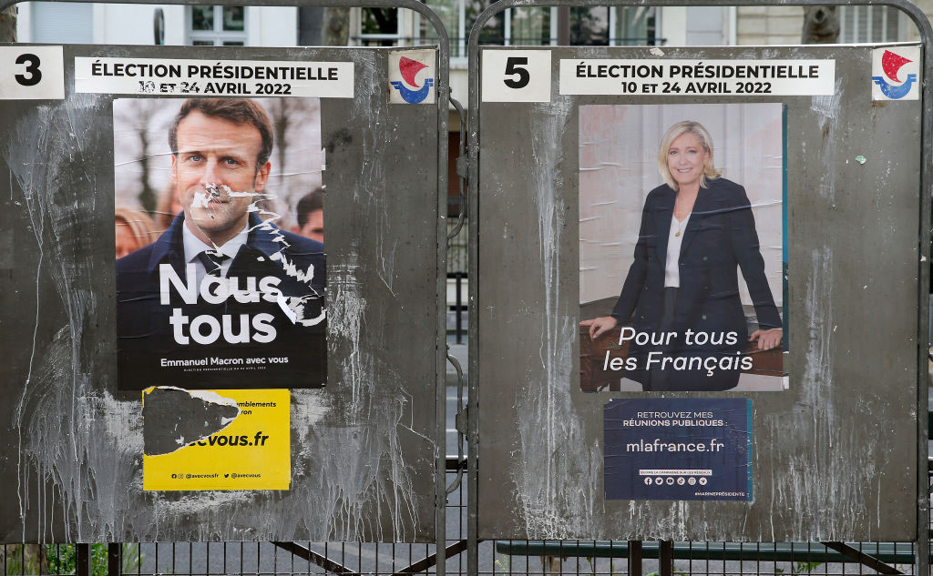Official campaign posters of Marine Le Pen, leader of the far-right Rassemblement national (RN) party and French President Emmanuel Macron 'La République en marche' (LREM), candidates in the 2022 French presidential election (Chesnot-Getty Images)