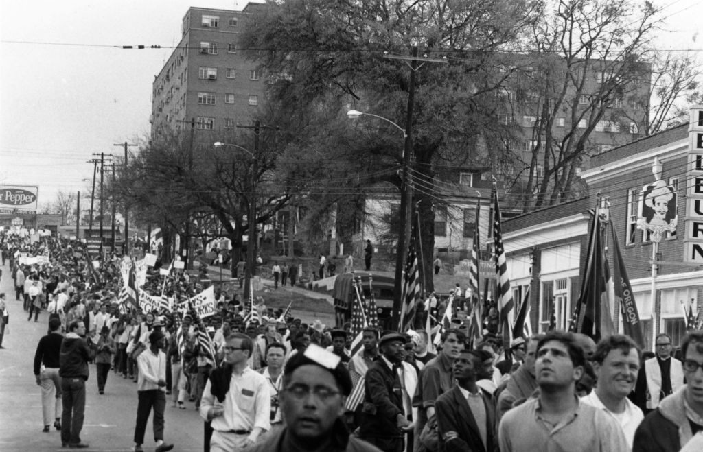 March 1965:  Civil rights protesters, led by Dr Martin Luther King, marching for black voting rights from Selma, Alabama, to the state capitol in Montgomery. (William Lovelace-Express)