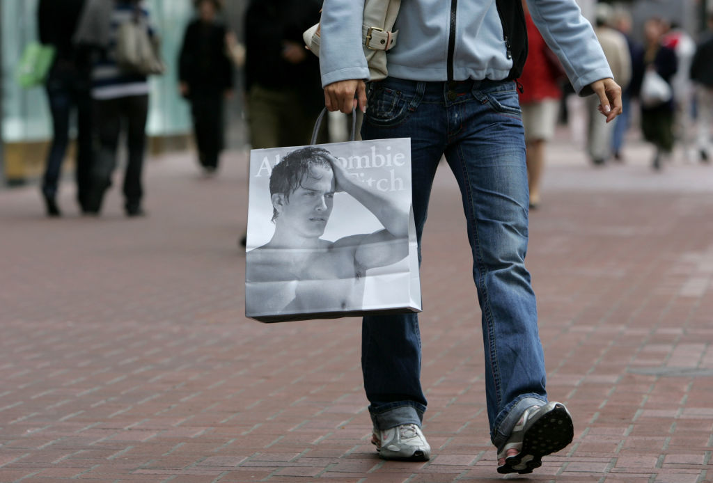 A shopper carries an Abercrombie and Fitch bag after leaving the store in San Francisco, Calif. on May 10, 2007.