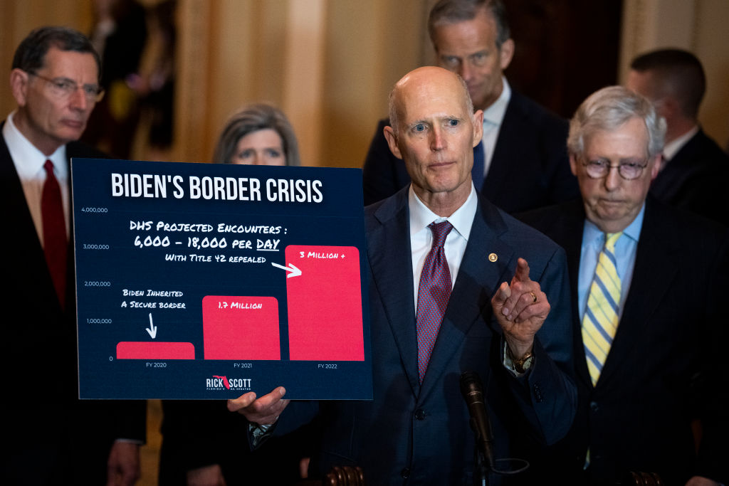 Sen. Rick Scott, R-Fla., references border crossings during a news conference after the Senate luncheons in the U.S. Capitol on Tuesday, April 5, 2022. Also appearing from left are, Sens. John Barrasso, R-Wyo., Joni Ernst, R-Iowa, John Thune, R-S.D., and Senate Minority Leader Mitch McConnell, R-Ky. (Tom Williams—CQ-Roll Call, Inc./Getty Images)
