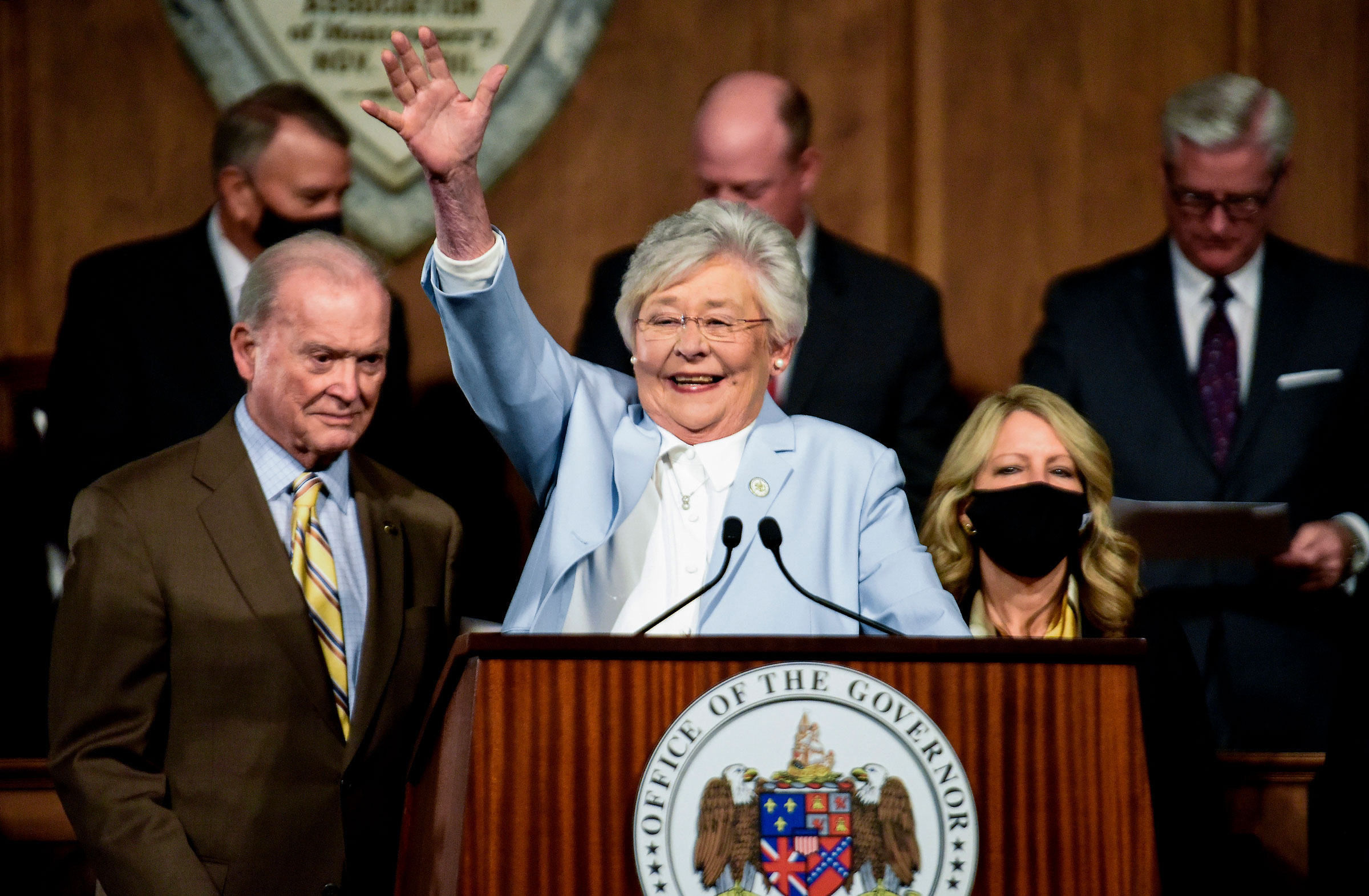 Alabama Gov. Kay Ivey waves as she arrives to deliver her State of the State address at the State Capitol Building in Montgomery, Ala., Jan. 11, 2022. (Mickey Welsh—The Montgomery Advertiser/AP)