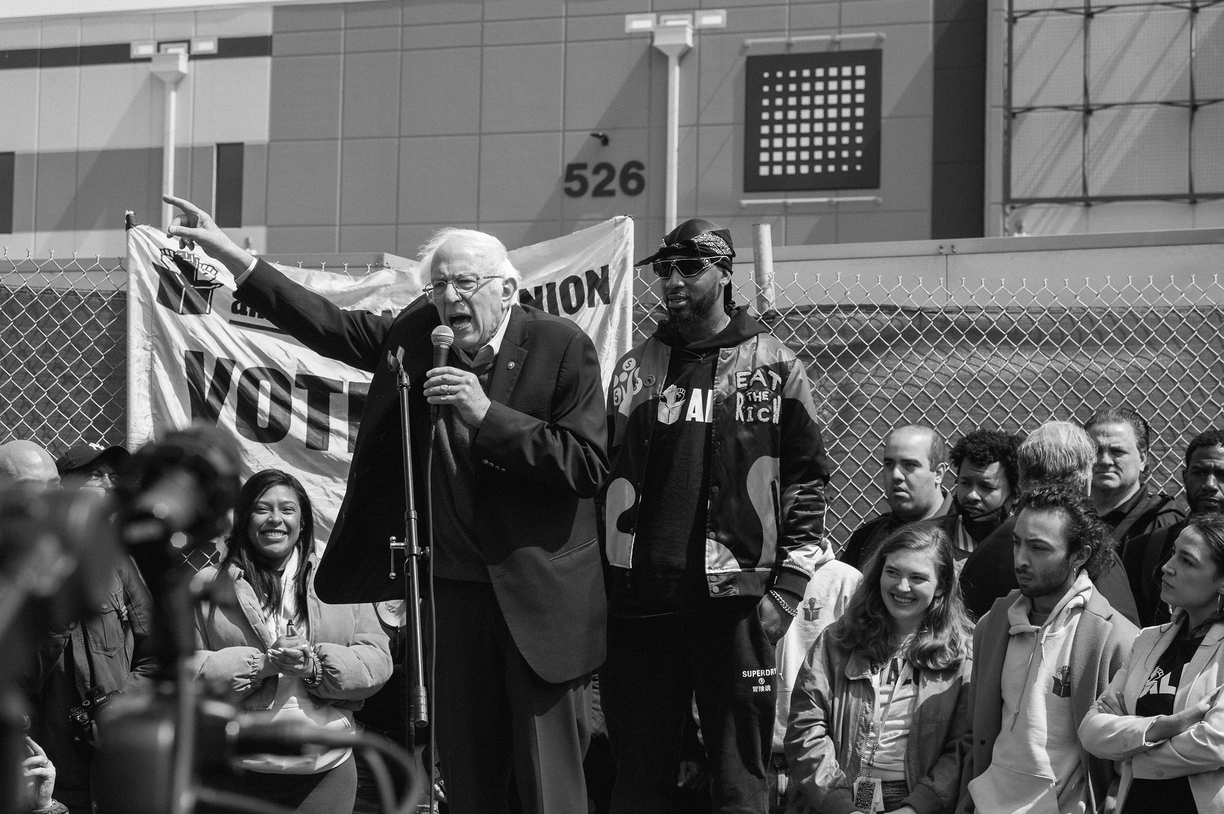 Senator Bernie Sanders, speaks next to Christian Smalls, founder of the Amazon Labor Union (ALU), during rally in the Staten Island,New York on April 24, 2022. (Stephen Obisanya for TIME)