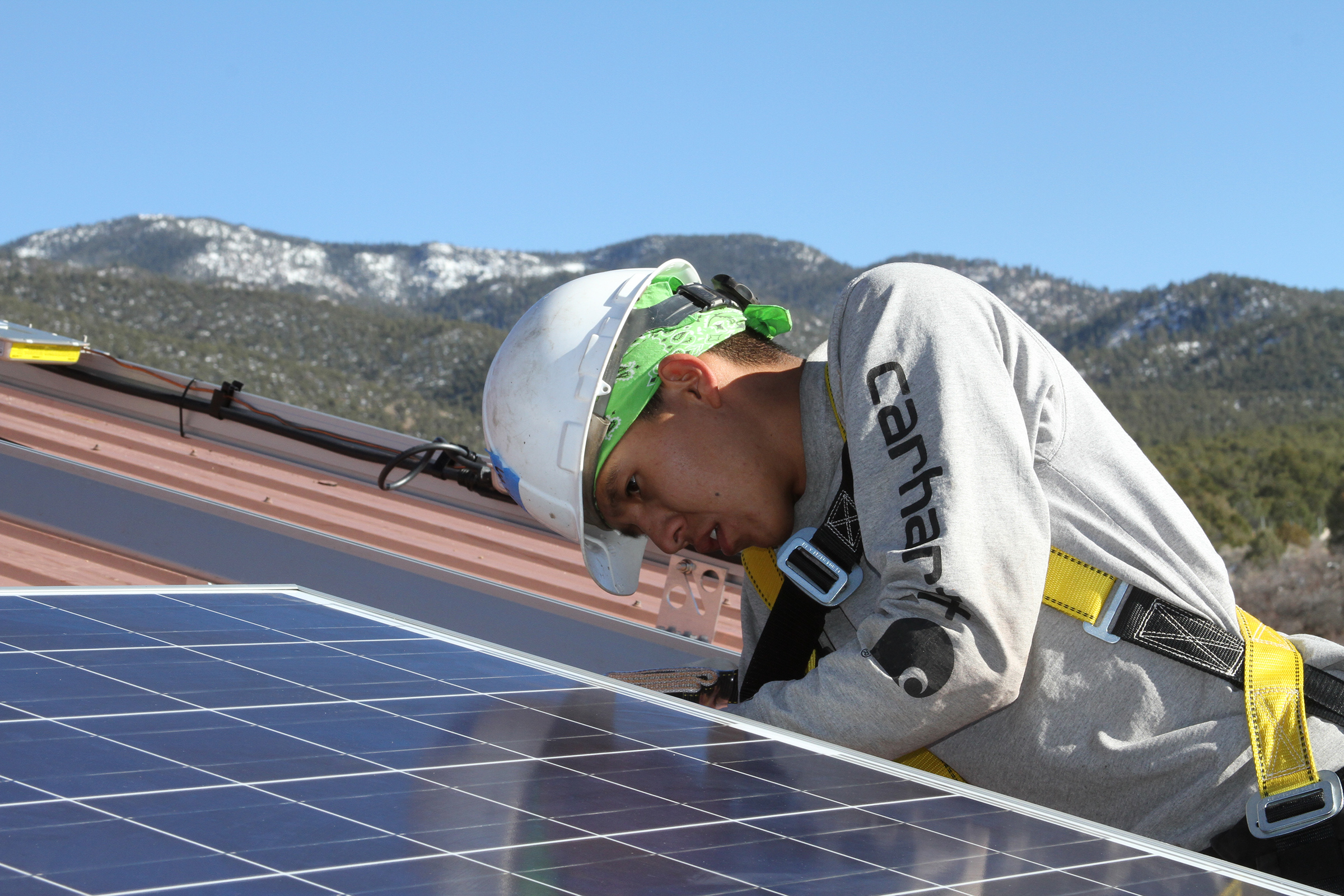 A GRID Alternatives tribal job trainee installs solar for the Picuris Pueblo tribe of New Mexico (Business Wire/AP)
