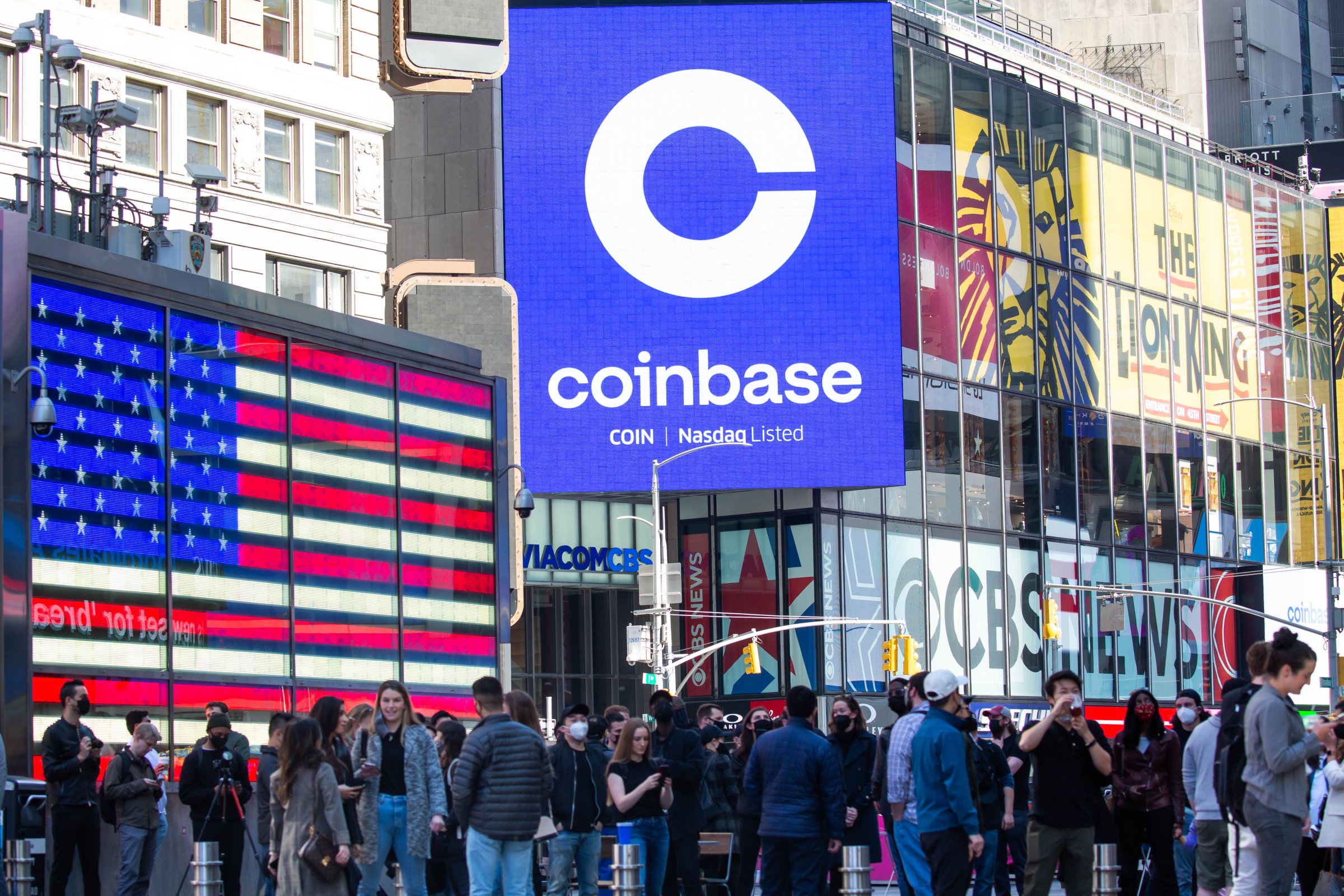 Monitors display Coinbase signage during the company's initial public offering (IPO) at the Nasdaq MarketSite in New York, on April 14, 2021.