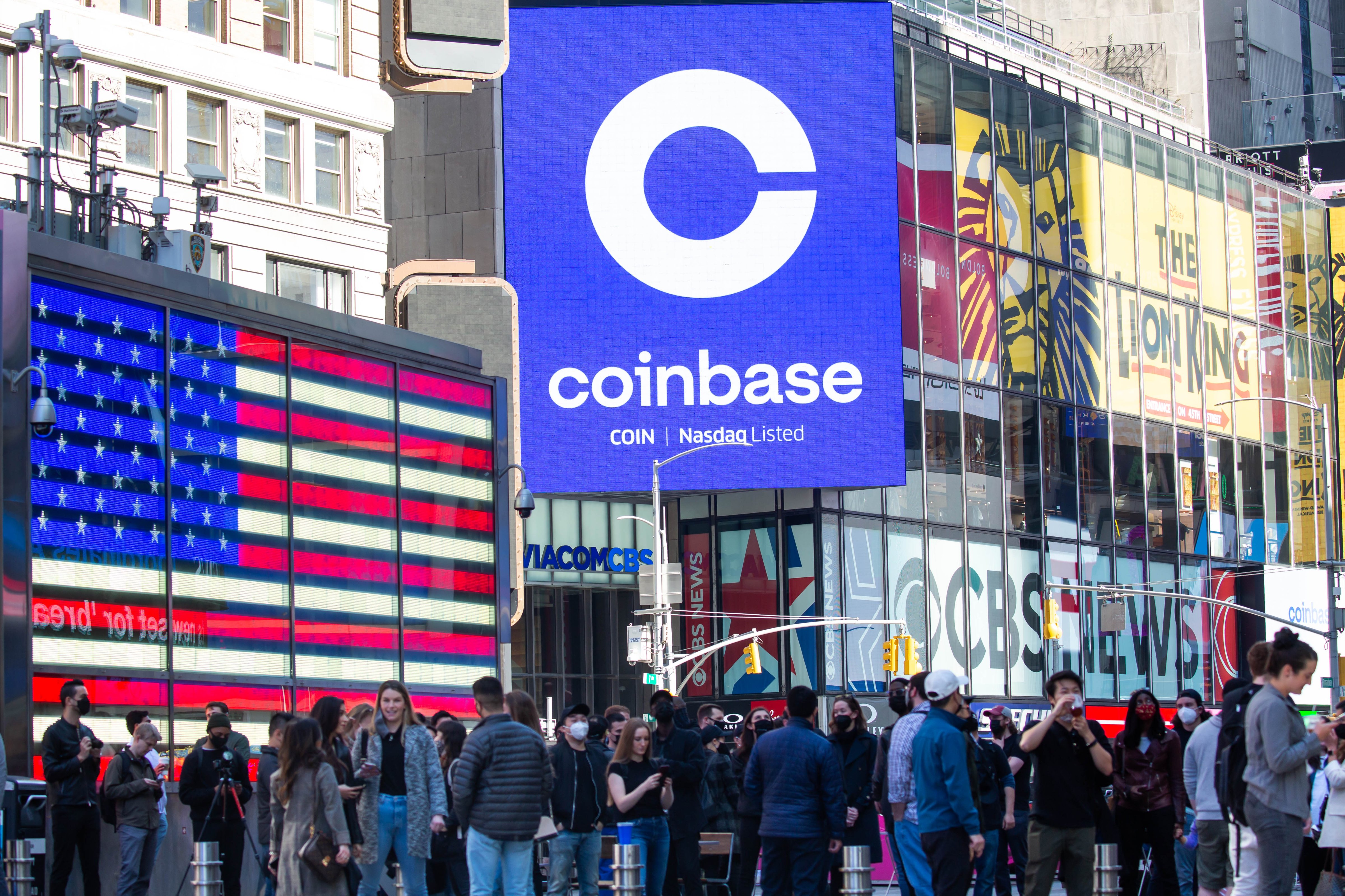 Monitors display Coinbase signage during the company's initial public offering (IPO) at the Nasdaq MarketSite in New York, on April 14, 2021. (Michael Nagle—Bloomberg/Getty Images)