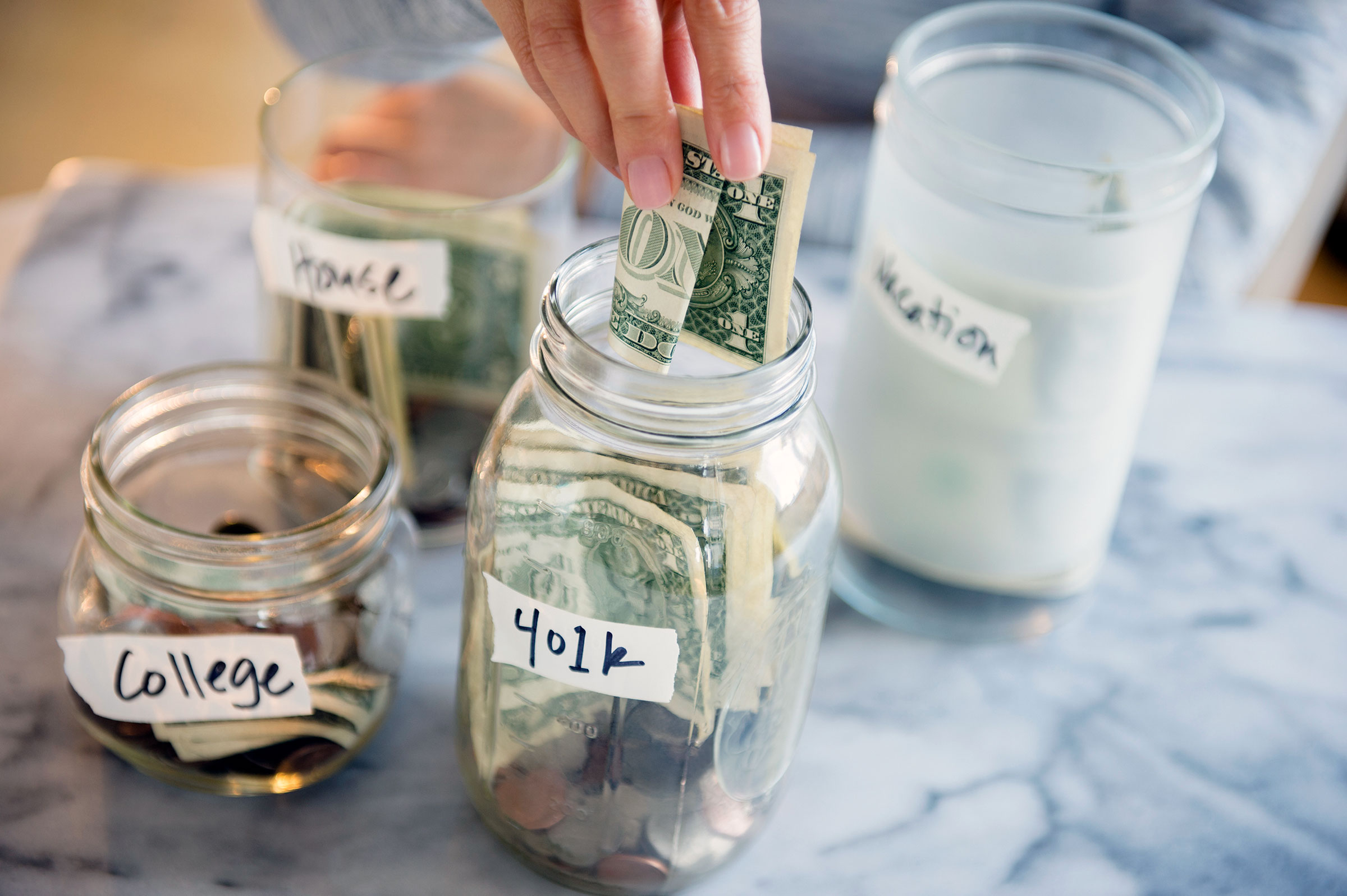 Experts recommend prioritizing necessities and paying down debt when prices are high. (Jamie Grill—Tetra Images/Getty Images)