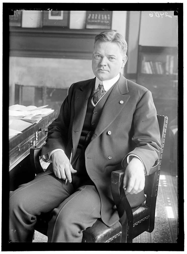 Portrait of American politician (and future U.S. President) Herbert Hoover, as he sits at a desk, during his tenure as head of the U.S. Food Administration, 1917. (PhotoQuest—Getty Images)