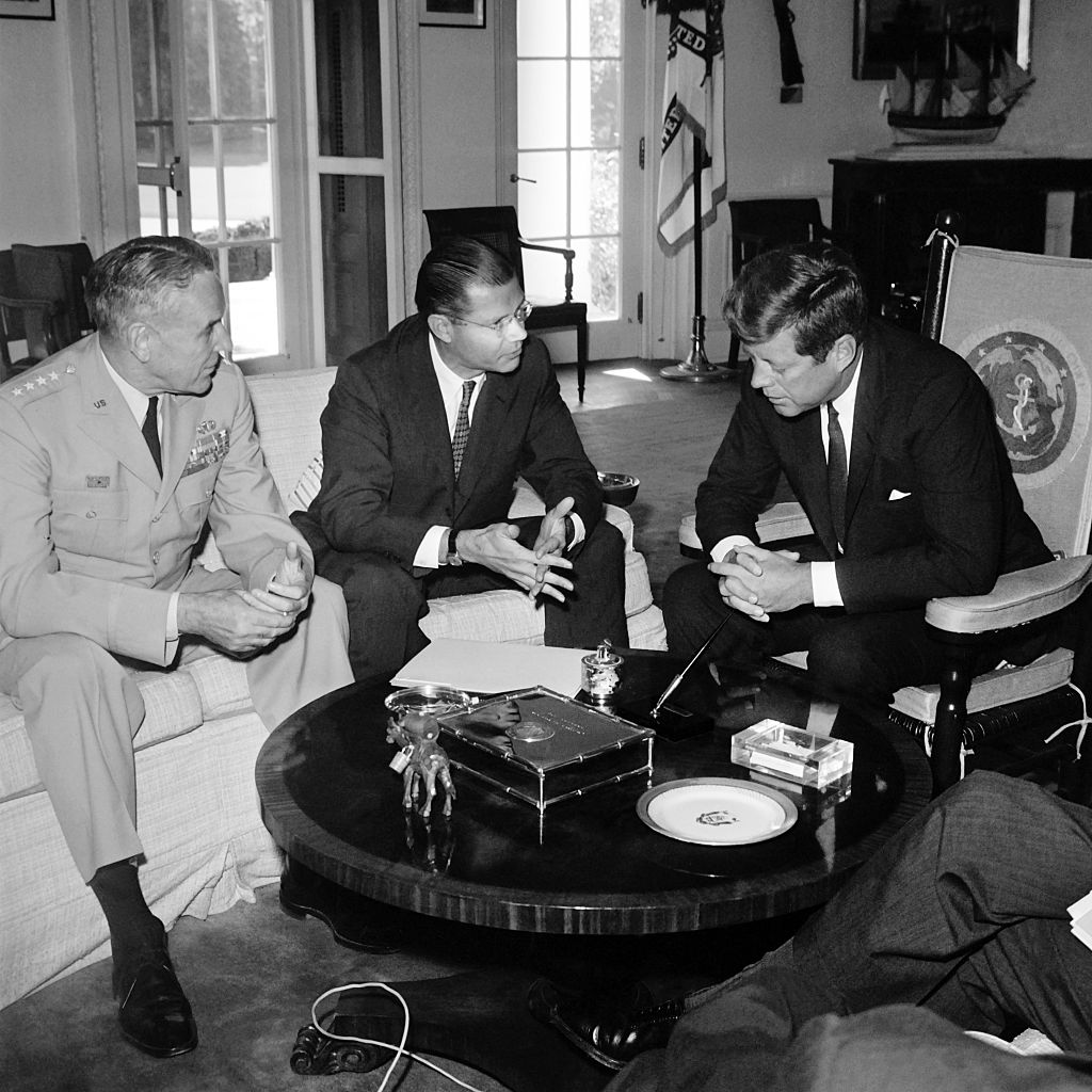 U.S. Secretary of Defense Robert McNamara (C) and U.S. Army chief-of-staff General Maxwell Taylor (L) confer on Sept. 24, 1963, at the White House in Washington, D.C., with U.S. President John F. Kennedy prior to their visit to South Vietnam to review U.S. military efforts. (AFP—Getty Images)