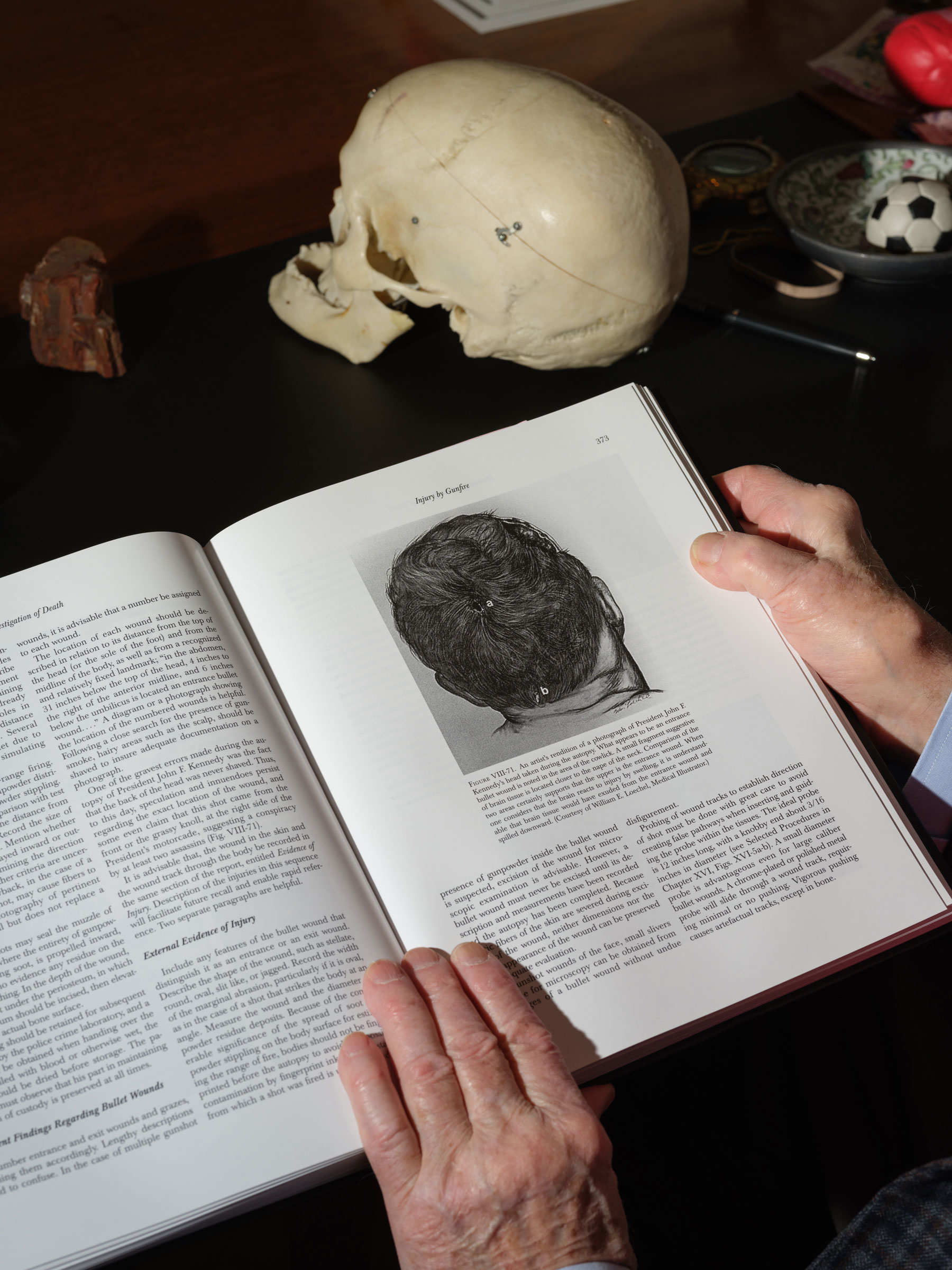 a book showing an artist rendition of a photograph of President John F. Kennedy’s head