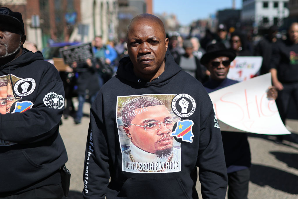 Peter Lyoya, the father of Patrick Lyoya, marches on April 21, 2022, to the Michigan state capital building in Lansing, Mich., where demonstrators called on the Grand Rapids police department to name, arrest, and prosecute the officer that shot his son. (Scott Olson—Getty Images)