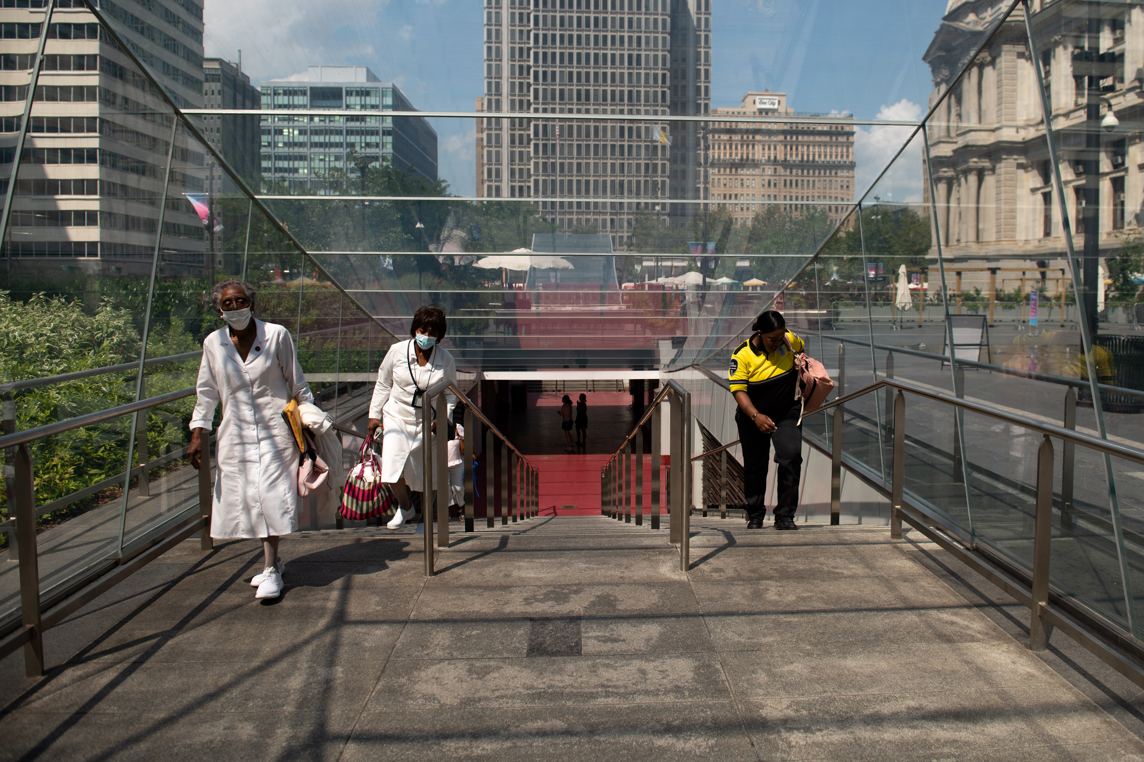 Commuters exit a subway stop at City Hall in Philadelphia, Pennsylvania, U.S., on Thursday, Aug. 12, 2021. (Kriston Jae Bethel—Bloomberg)