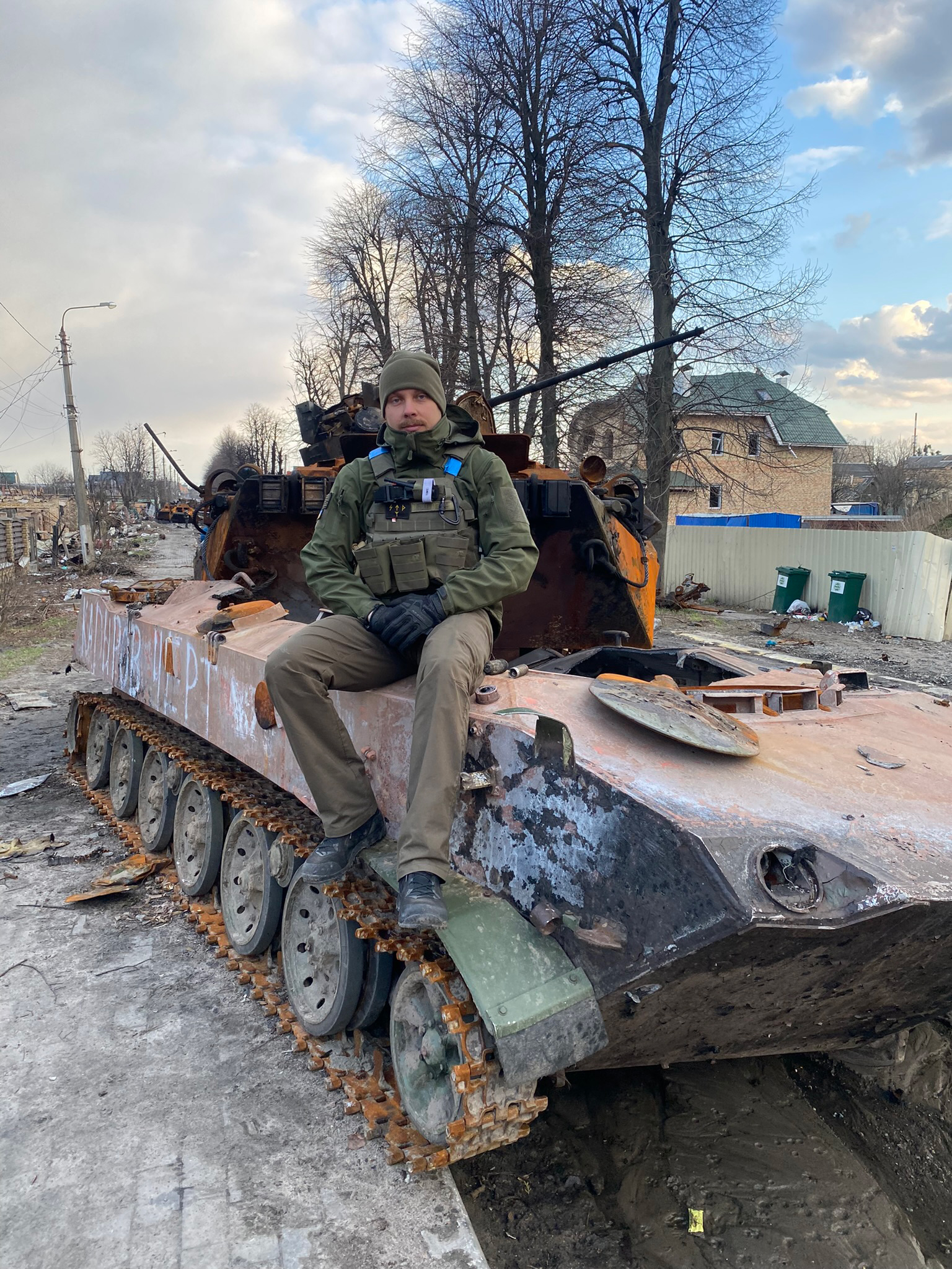 Povilas Limontas sitting on a tank in Bucha on April 4, 2022.