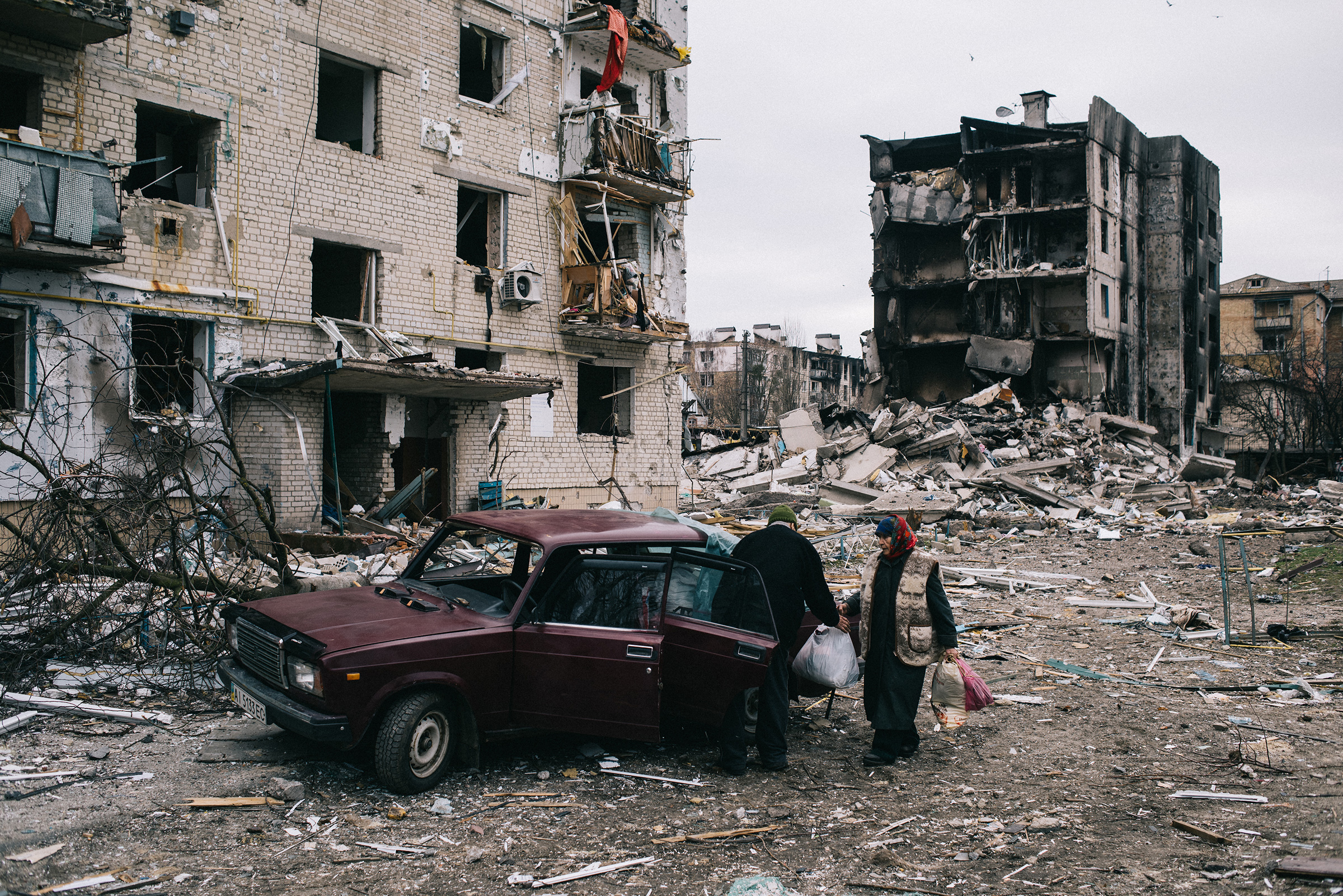 The town of Borodyanka may have faced some the worst attacks since Russia launched its invasion of Ukraine. A "ruined town" strewn with destroyed buildings and burnt armored vehicles. School buildings, homes and apartments in the town center were severely damaged as a result of air and ground strikes. On the photo an elderly couple collects things survived from in a bombed apartment and going to leave on a car. The town of Borodyanka, Kyiv region, 05.04.2022