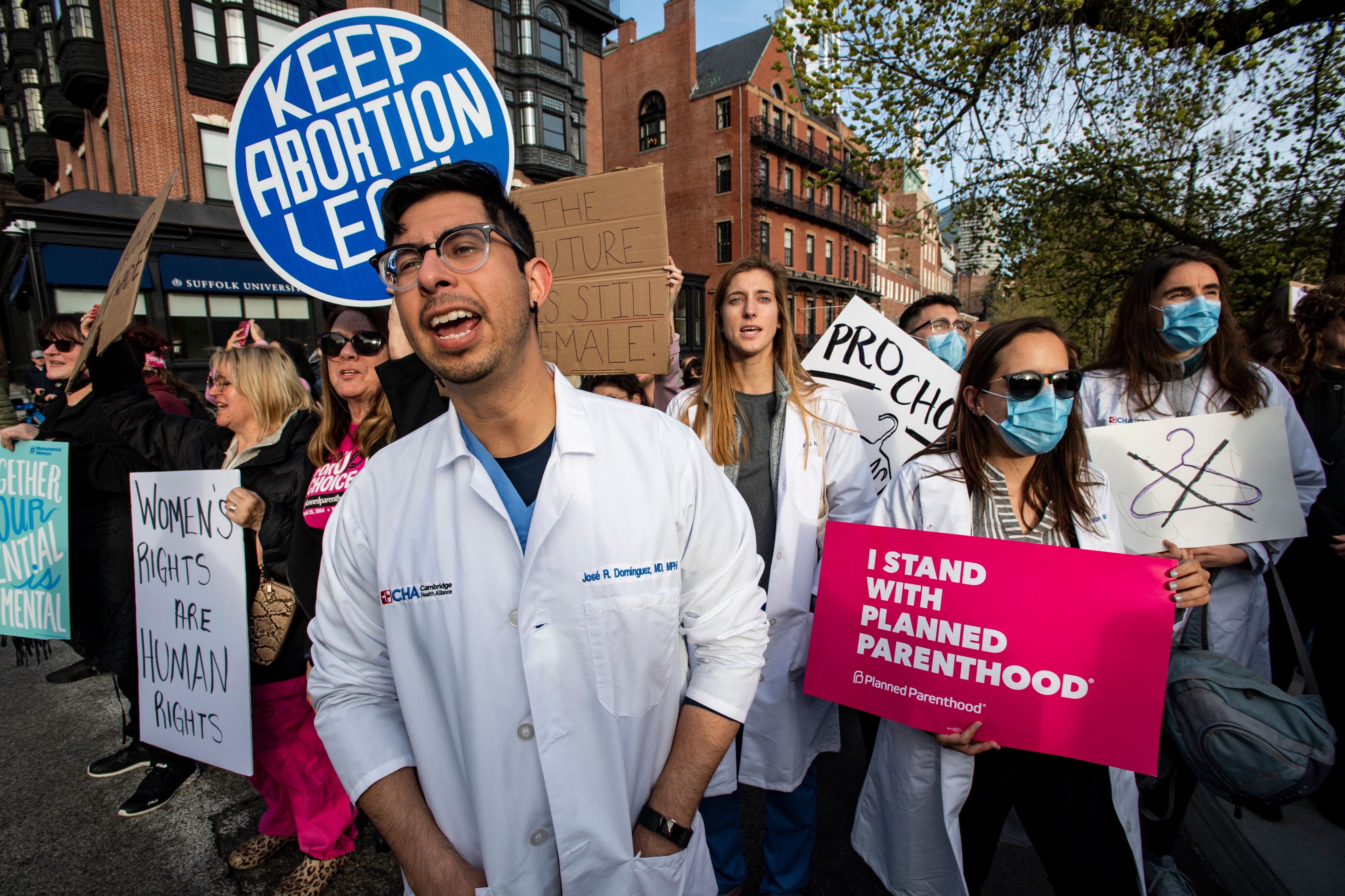 A group of doctors and medical workers join protesters gathering in front of the State House to show support and rally for abortion rights in Boston, Massachusetts on May 3. (Joseph Prezioso / AFP)