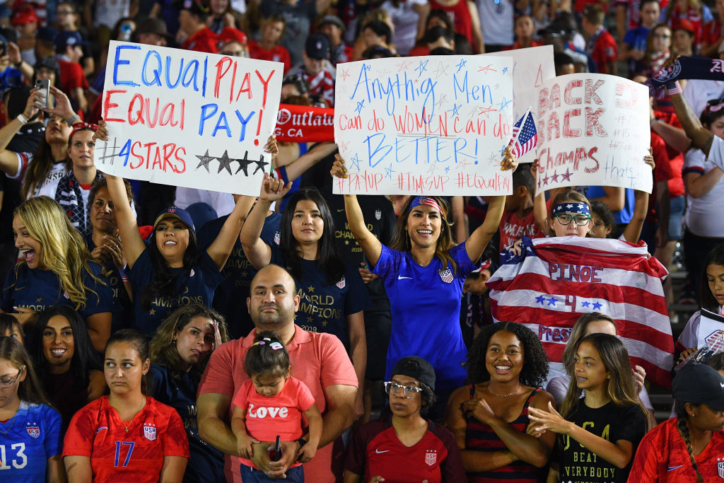 Fans hold a women's rights and equal pay sign up during the USA Victory Tour match between the United States of America and the Republic of Ireland on August 3, 2019 at the Rose Bowl in Pasadena, CA (Brian Rothmuller/Icon Sportswire via Getty Images)