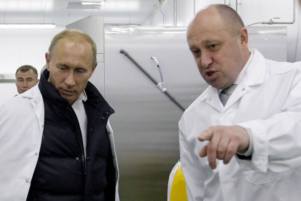 Yevgeny Prigozhin shows Russian Prime Minister Vladimir Putin his school lunch factory outside Saint Petersburg on September 20, 2010. The European Union in October sanctioned Prigozhin accusing him of undermining peace in Libya by supporting the Wagner Group private military company. (Photo by Alexey DRUZHININ-SPUTNIK / AFP) (SPUTNIK/AFP via Getty Images)