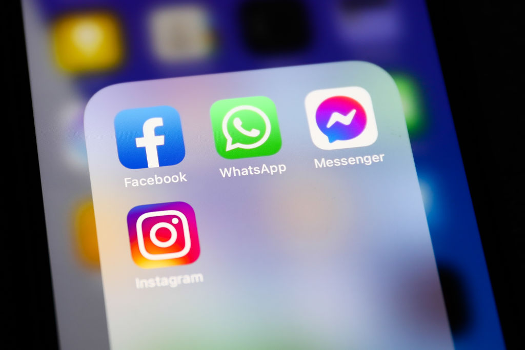 Facebook, WhatsApp, Messenger and Instagram icons displayed on a phone screen are seen in this illustration photo taken in Krakow, Poland on April 6, 2022. (Jakub Porzycki—NurPhoto/Getty Images)