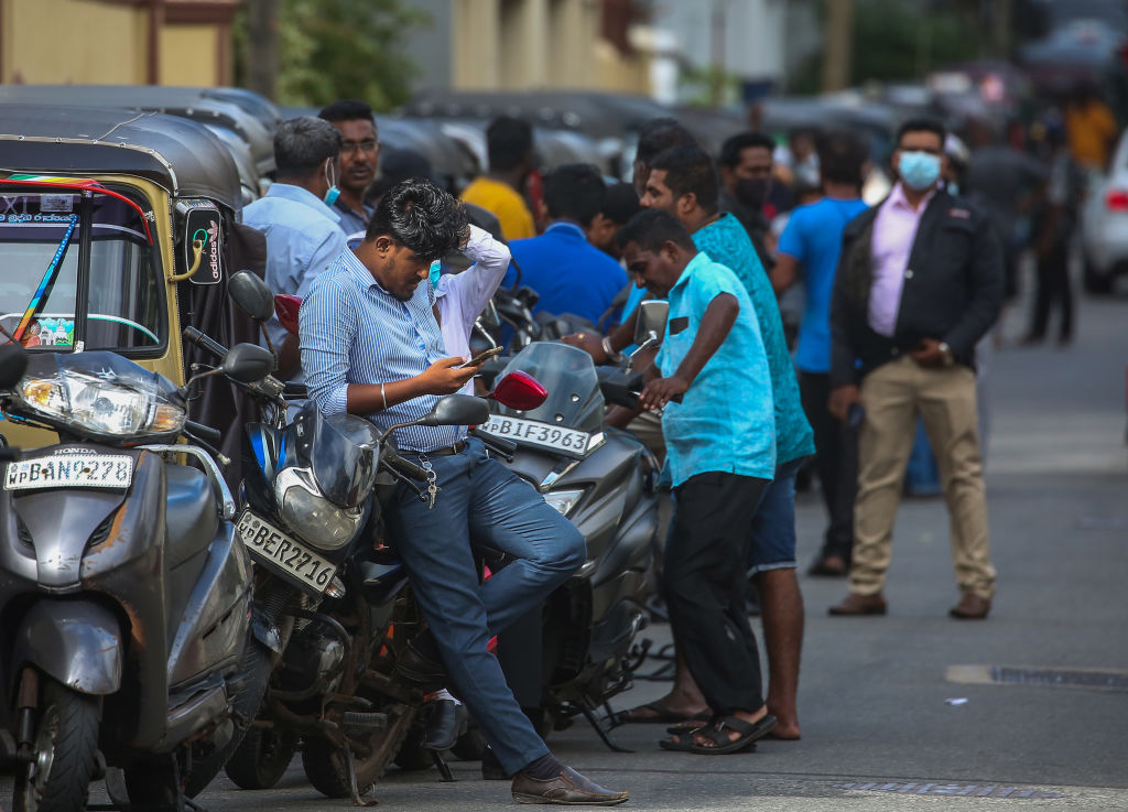 People waiting to buy petrol at a petrol station due to the fuel shortage in Colombo on May 17, 2022. (Pradeep Dambarage/NurPhoto—Getty Images)