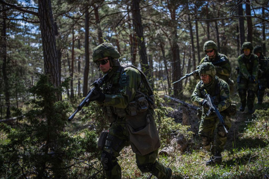 Swedish Home Guard soldiers take part in a field exercise near Visby on the Swedish island of Gotland on May 17, 2022. - Finland and Sweden are expected to announce this week whether to apply to join NATO following Russia's Ukraine invasion, in what would be a stunning reversal of decades-long non-alignment policies. On Sweden's strategically-located Baltic Sea island of Gotland, Home Guard troops were last week called in for a special month-long training exercise, coinciding with annual military exercises taking place across Finland and Sweden next week. (Photo by Jonathan NACKSTRAND / AFP) (Photo by JONATHAN NACKSTRAND/AFP via Getty Images) (AFP via Getty Images)