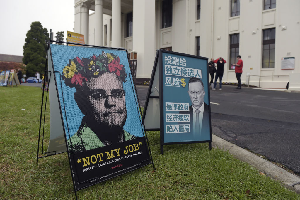 Campaign posters displayed outside an early polling station in the Box Hill suburb of Melbourne, Victoria, Australia, on Friday, May 13, 2022. (Carla Gottgens/Bloomberg via Getty Images)