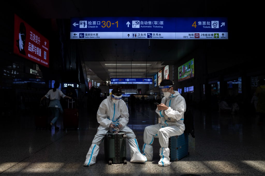 Travelers wait for their trains at Hongqiao Railway Station in Shanghai, China Sunday, May 22, 2022. (MING DE/ Feature China/Future Publishing via Getty Images)