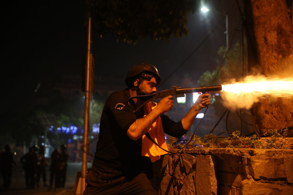 Pakistani police and supporters of ex Prime Minister Imran Khan clash in Islamabad on May 25. (Muhammed Semih Ugurlu—Anadolu Agency/Getty Images)