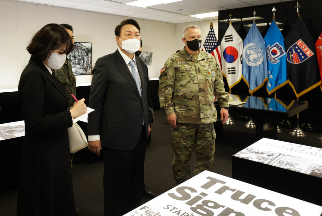 In this handout image provided by the U.S. Army, then president-elect of South Korea, Yoon Suk-yeol (2nd L) stands with Gen. Paul J. LaCamera (R) of United Nations Command/Combined Forces Command, and U.S. Forces Korea Commander, during his visit at Camp Humphreys on April 7, 2022 in Pyeongtaek, South Korea. (Staff Sgt. Kris Bonet—U.S. Army via Getty Images)