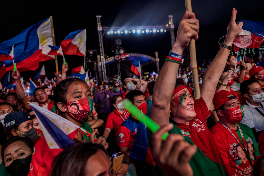 Supporters of Ferdinand "Bongbong" Marcos Jr. and running mate Sara Duterte cheer during their last campaign rally before the election on May 7, 2022 in Paranaque, Metro Manila, Philippines. (Ezra Acayan/Getty Images)