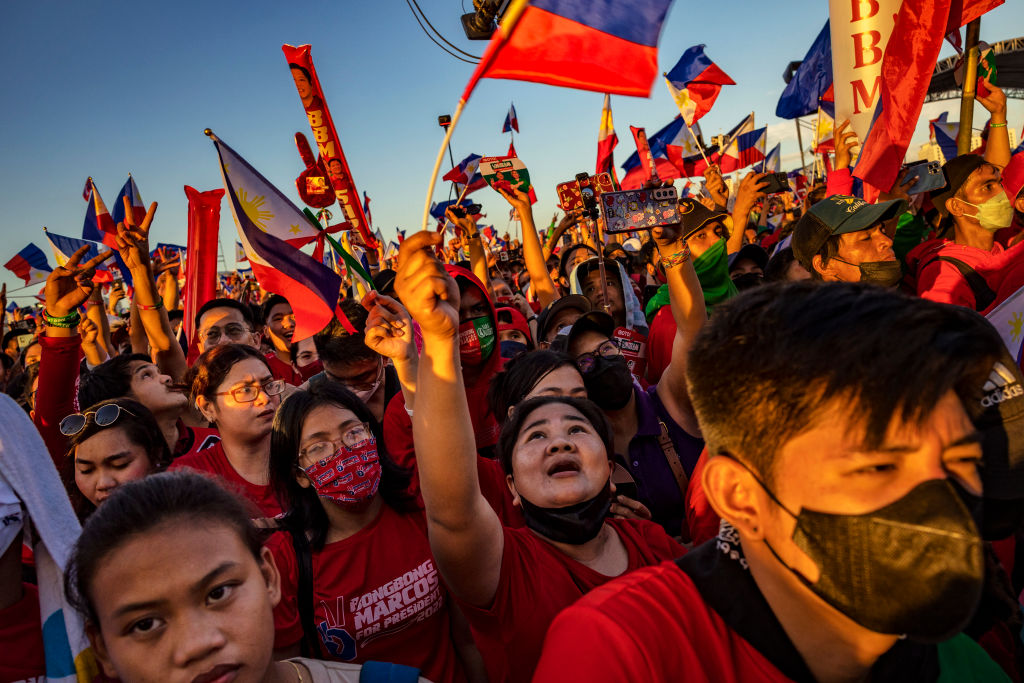 Supporters of Ferdinand "Bongbong" Marcos Jr. and running mate Sara Duterte cheer during their last campaign rally before the election on May 07, 2022 in Paranaque, Metro Manila, Philippines. (Ezra Acayan/Getty Images)