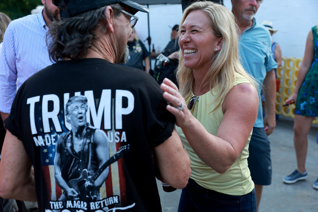 Rep. Marjorie Taylor Greene campaigns during a Bikers for Trump event held at the Crazy Acres Bar &amp; Grill in Plainville, Ga. on May 20, 2022. (Joe Raedle—Getty Images)