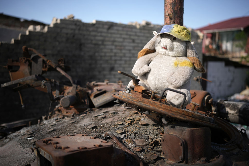 A children's cuddly toy sits on top of a destroyed Russian main battle tank, next to war damaged homes, on May 24, 2022 in Hostomel, Ukraine. As Russia concentrates its attack on the east and south of the country, residents of the Kyiv region are returning to assess the war's toll on their communities. (Christopher Furlong-Getty Images)