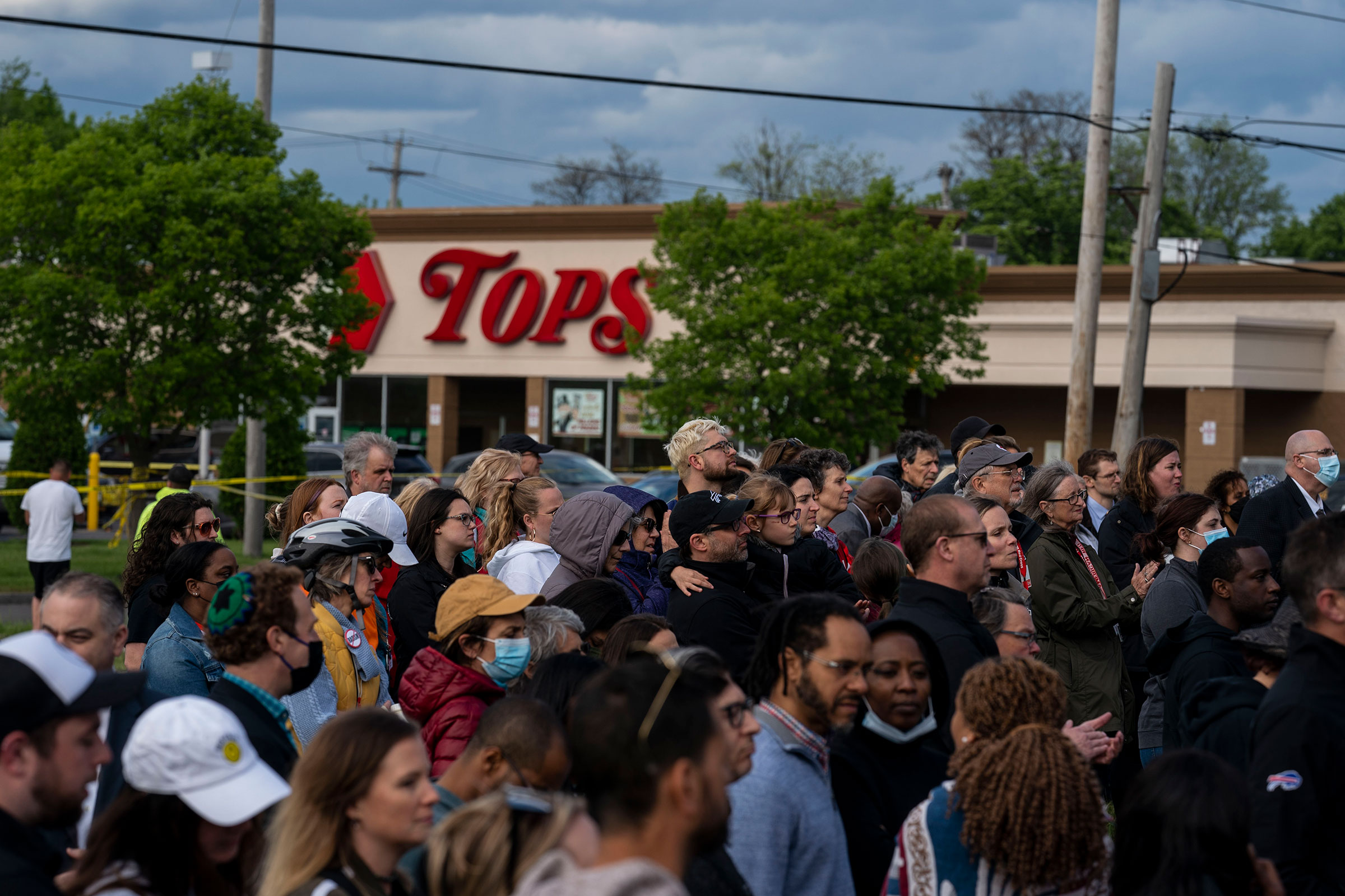 People attend a vigil across the street from Tops Friendly Market at Jefferson Avenue and Riley Street in Buffalo, on May 17. (Kent Nishimura—Los Angeles Times/Getty Images)