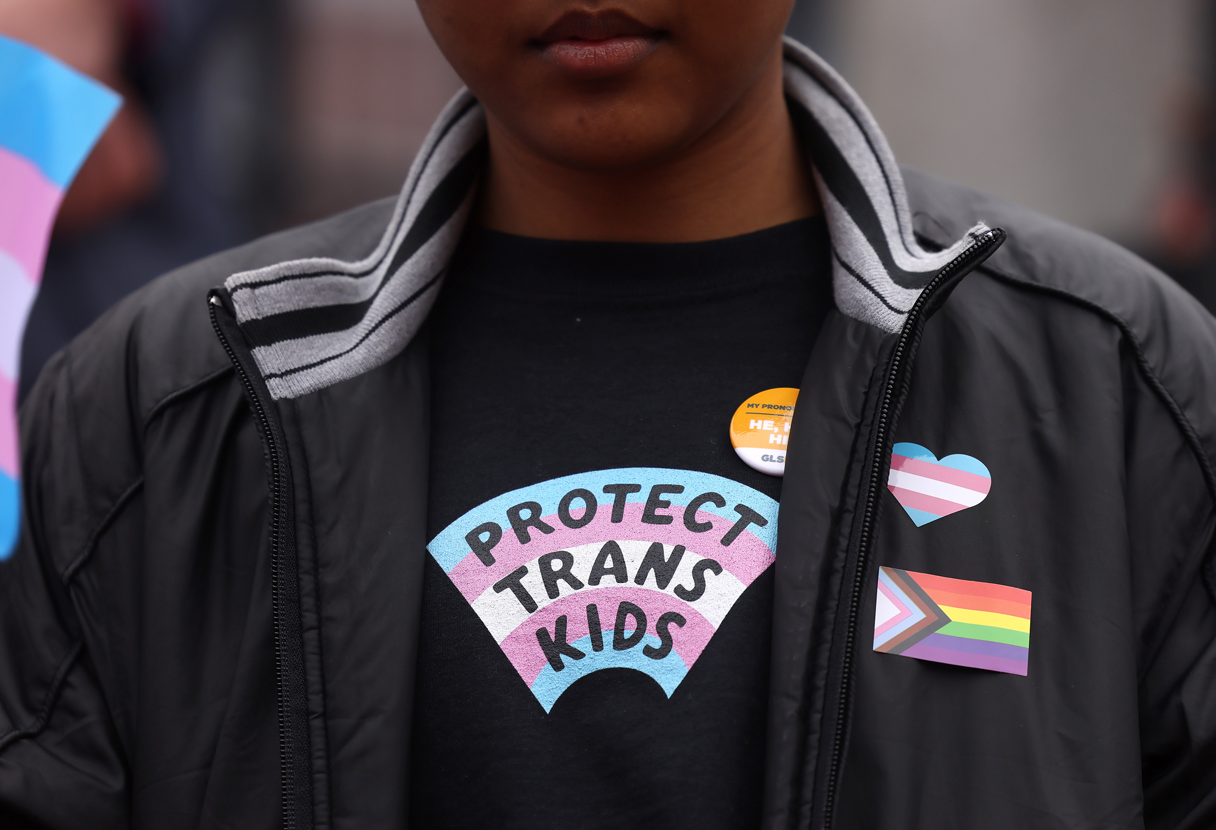 A person takes part in a rally during a Transgender Day of Visibility Event named, We Are A State of Love: A Gathering of Visible Solidarity With LGBTQ Youth outside of the State House in Boston on March 31, 2022. (Jessica Rinaldi—The Boston Globe/Getty Images)