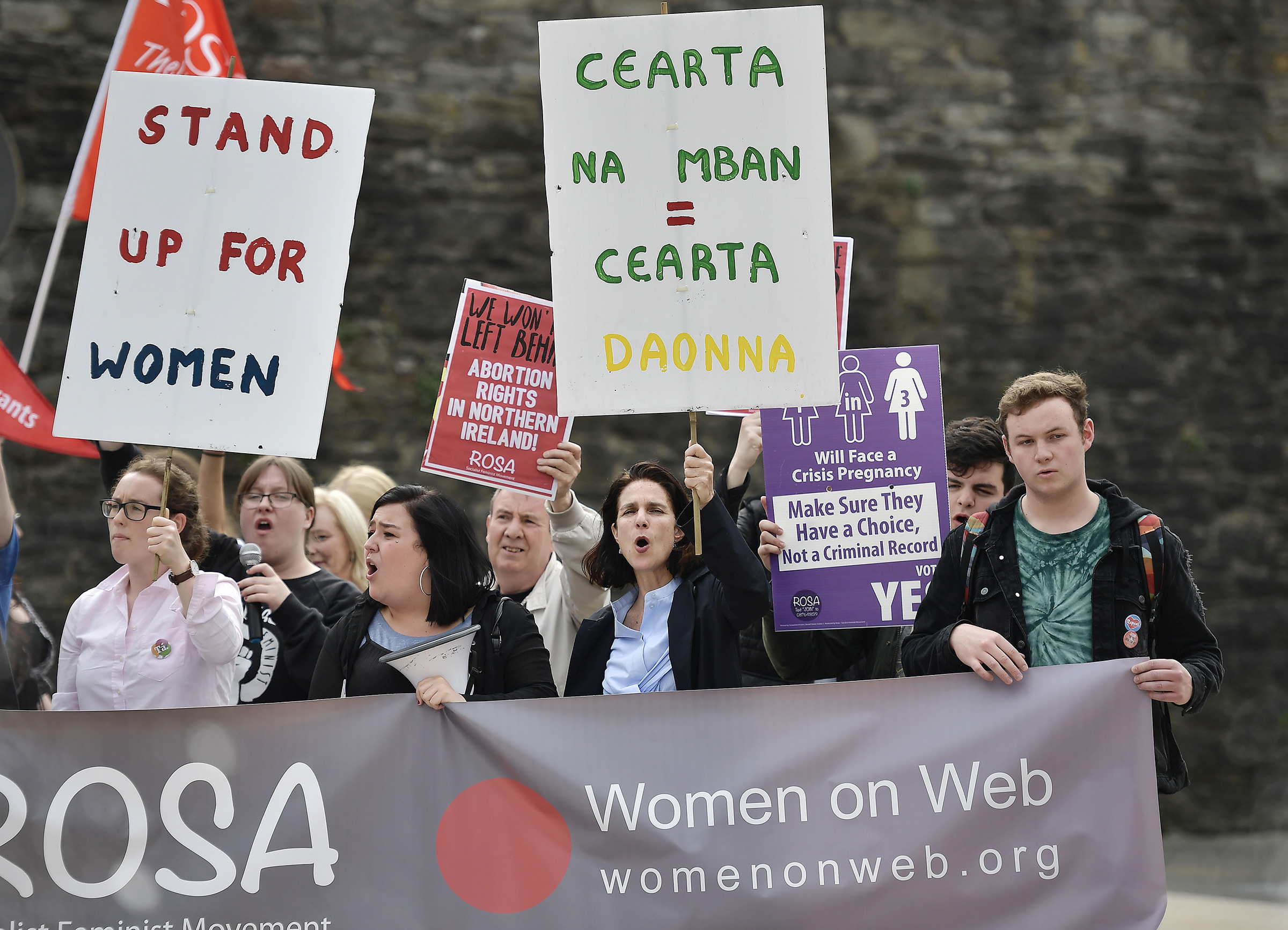 Dr. Rebecca Gomperts (2nd R) leads supporters in a chant as the abortion rights campaign group ROSA, Reproductive Rights Against Oppression, Sexism and Austerity hold a rally at Guildhall Square on May 31, 2018 in Londonderry, Northern Ireland. (Charles McQuillan—Getty Images)